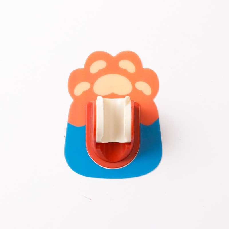 Suporte de chuveiro infantil em forma de pata de animal, ajustável e sem furos, cores laranja e azul.