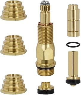 Kit de reparo de torneira em metal com diversos componentes dourados e junta preta